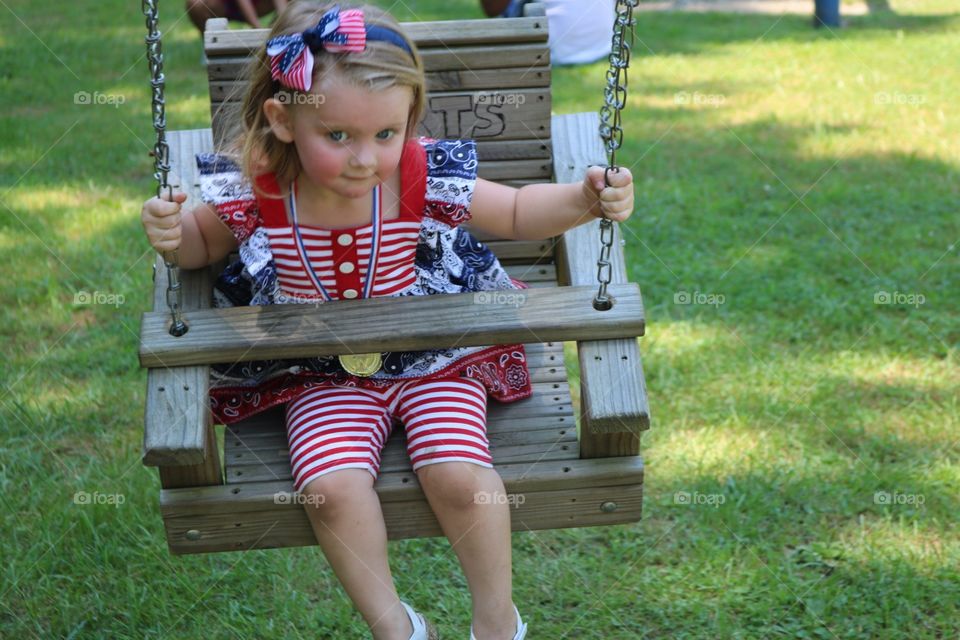 swinging in the park on the 4th of july