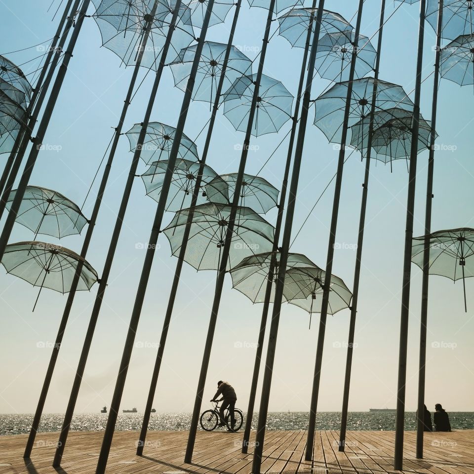 sunny umbrellas. The photo taken in the harbor of Thessaloniki, Greece