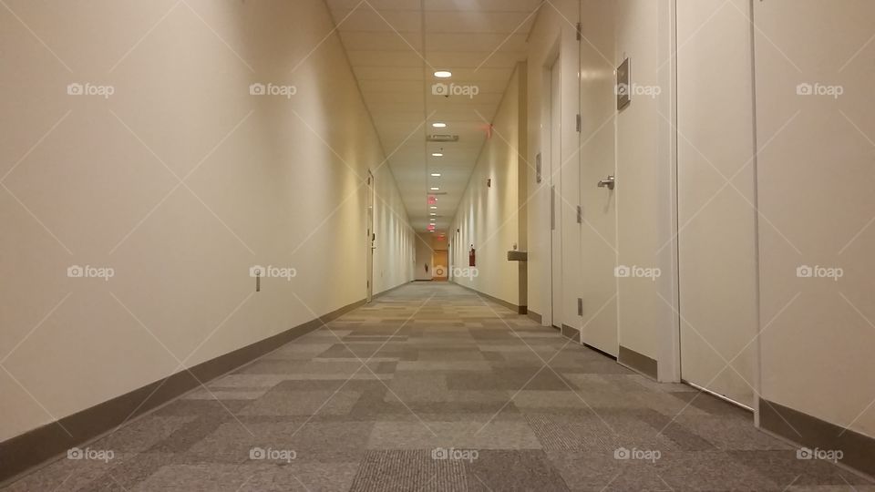 Empty, non-descript commercial hallway without windows