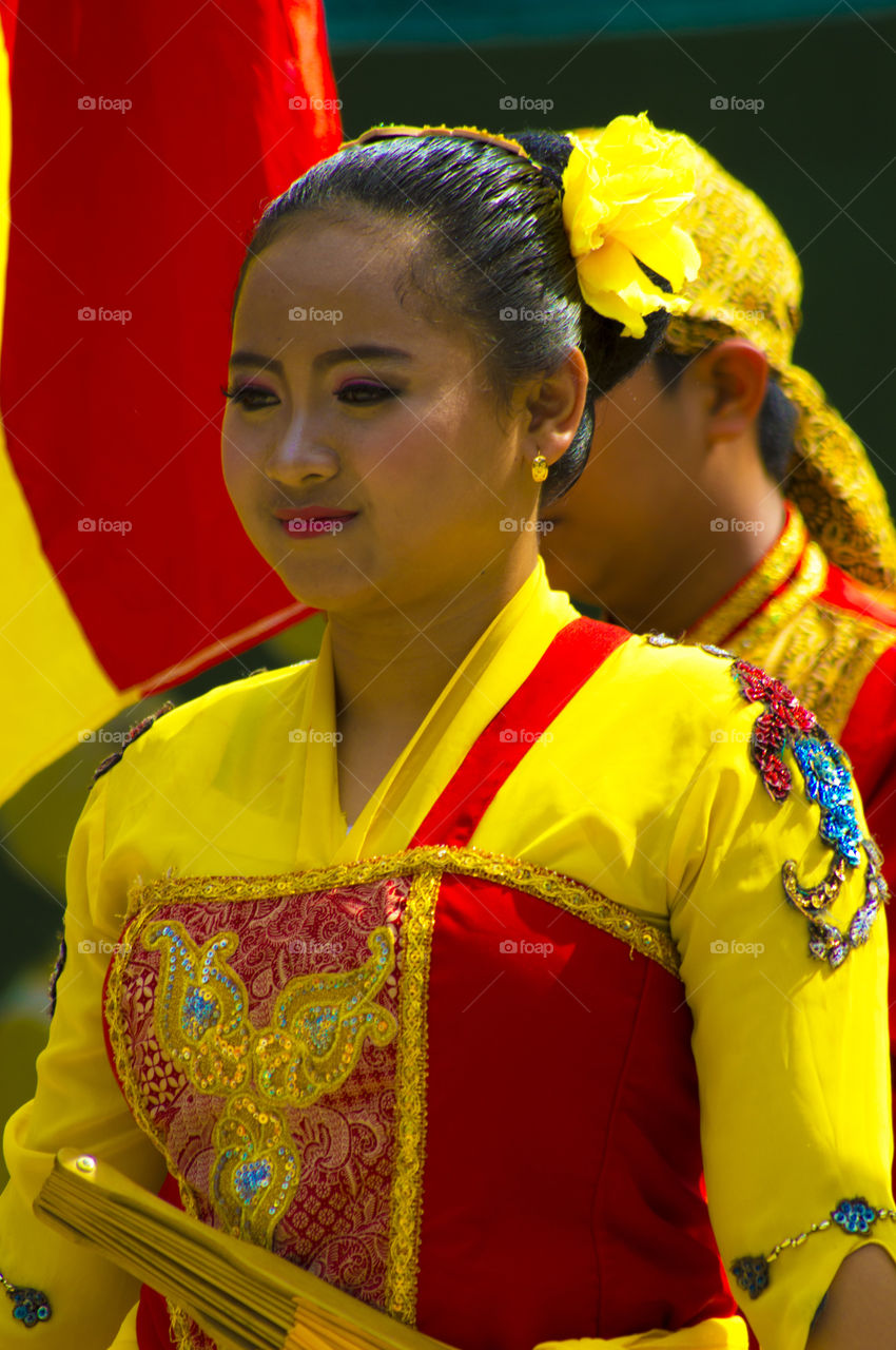 Portrait of Asian woman in yellow traditional dress