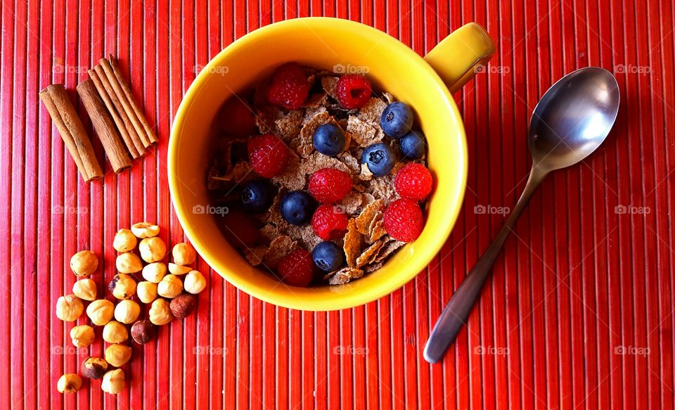 Cereal, berries and nuts for breakfast.