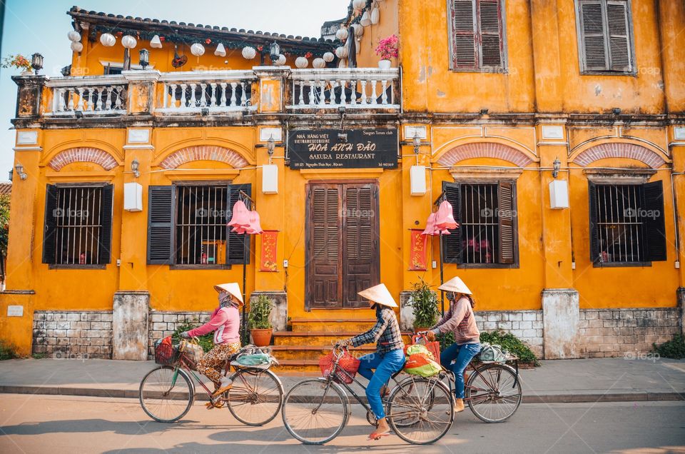 Three women riding their bikes