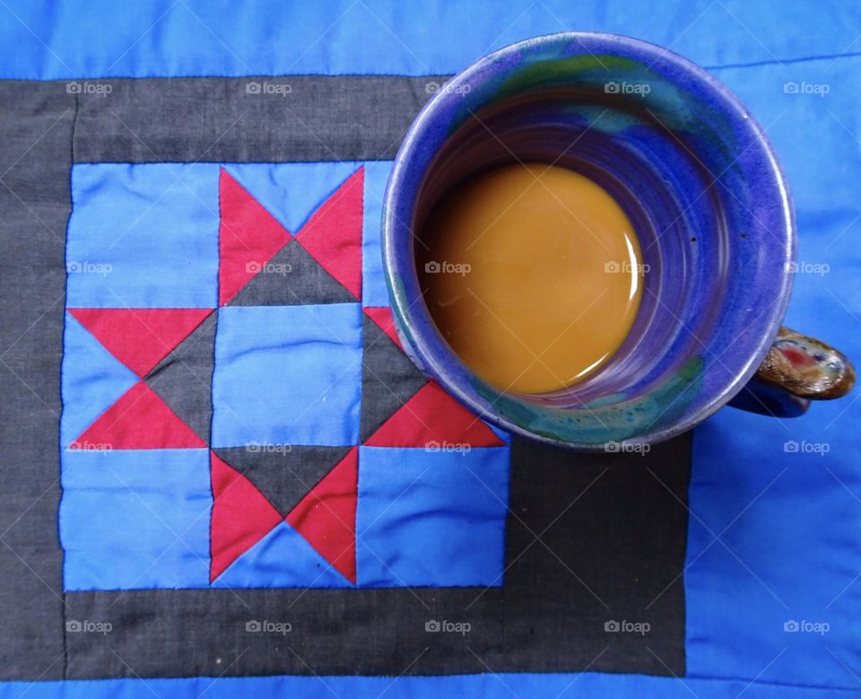 Coffee with milk in the blue mug