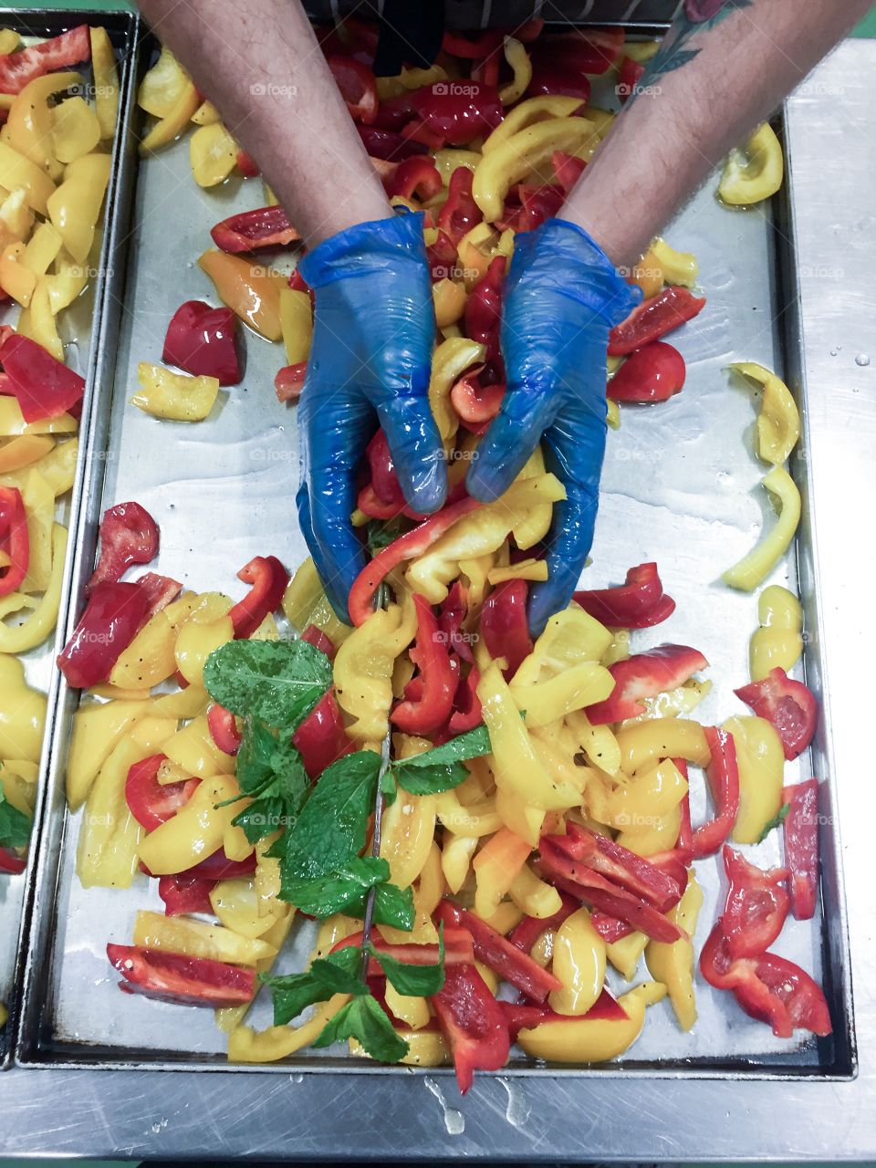 Close-up of hand mixing vegetables
