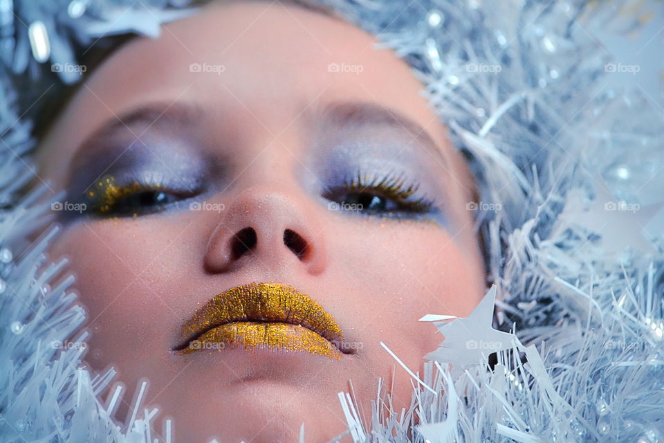 Close-up of glamour woman with tinsel