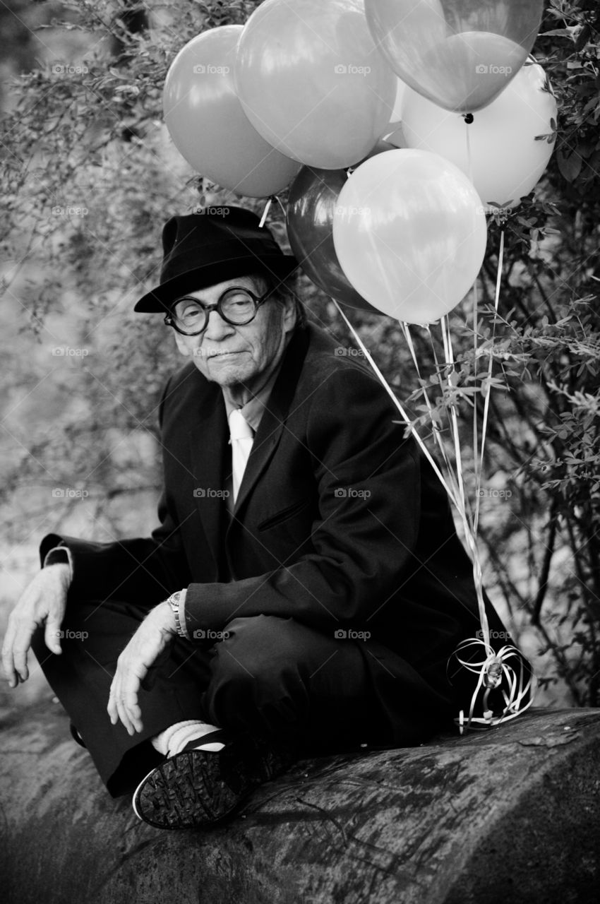 old man with balloons. my dad with balloons