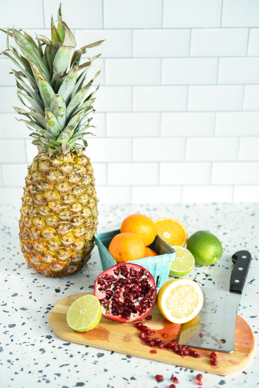 Still life of an assortment of fruit on a kitchen countertop