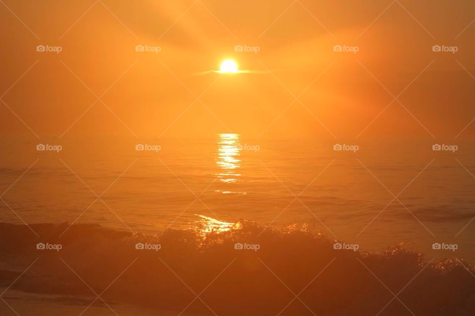 Jacob's Ladder. Gorgeous shot of the sun above the ocean, and Jacob's ladder sun beams. 