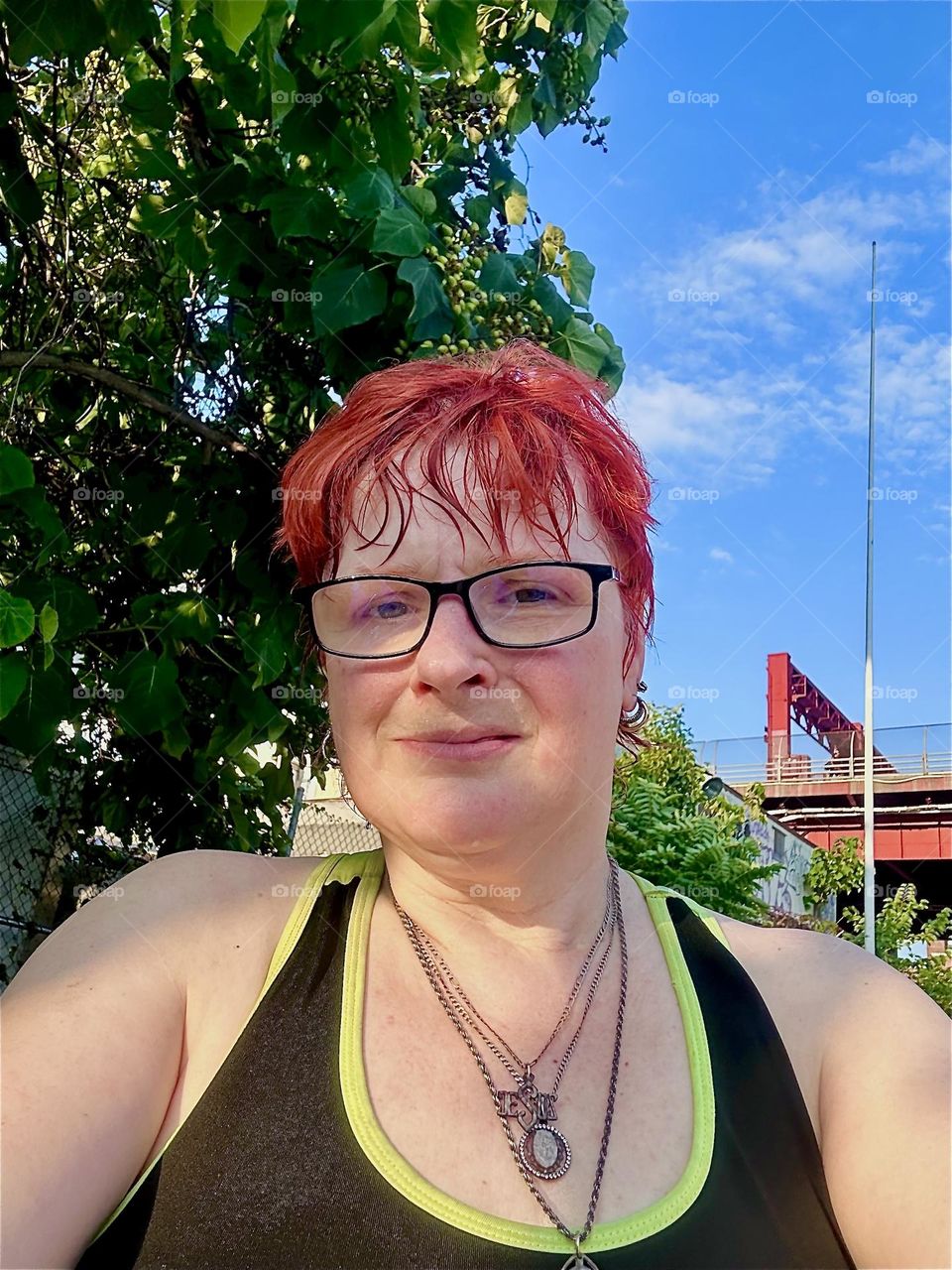 This is me, “Petra Schiller” a.k.a. “Maxine Firefox” a.k.a. “Maximiliane Feuerfuchs” for the bright red hair standing outside aboard “Salvation”, a “28 ft 1969 Luhrs” cabin cruiser at “Newtown Creek” in LIC, Queens. 2024. Hypnotic Productions