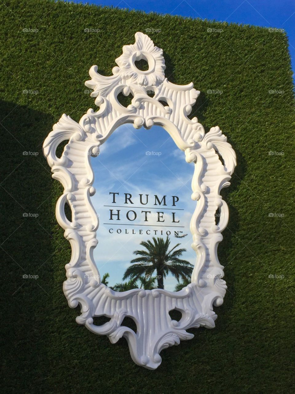 Trump Hotel. Mirror reflecting Palm trees at Trump hotel Doral, Florida 