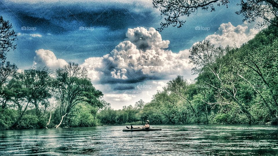 cloudy day kayaking on an Ozarks river