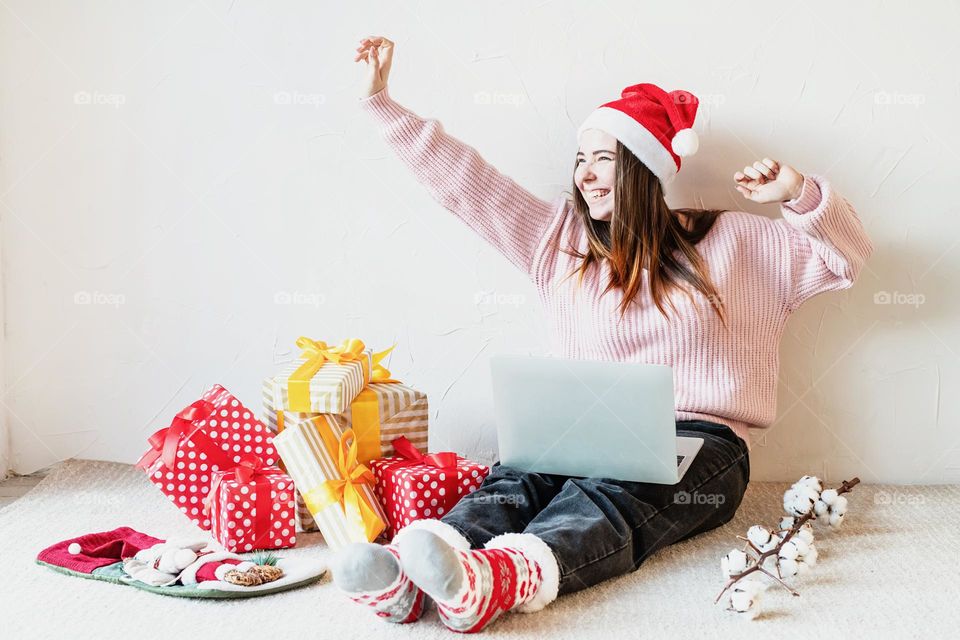 woman holding christmas gifts