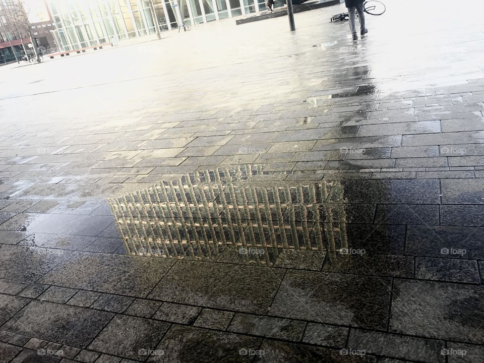 Reflection of a building in a pool of water