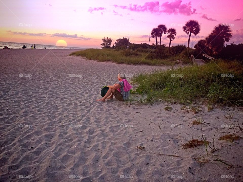 Woman at sunset on the beach