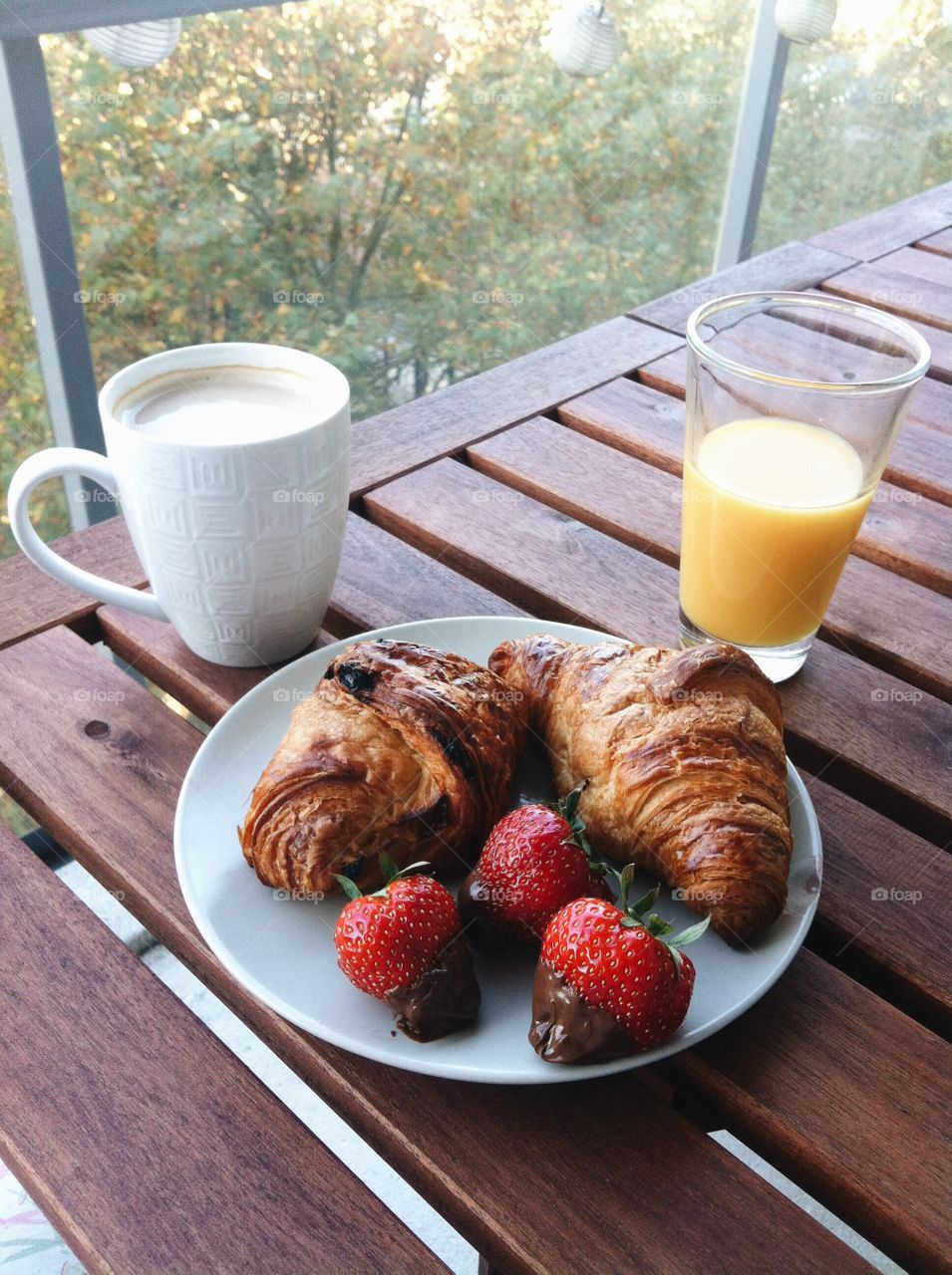 Croissant and juice for breakfast
