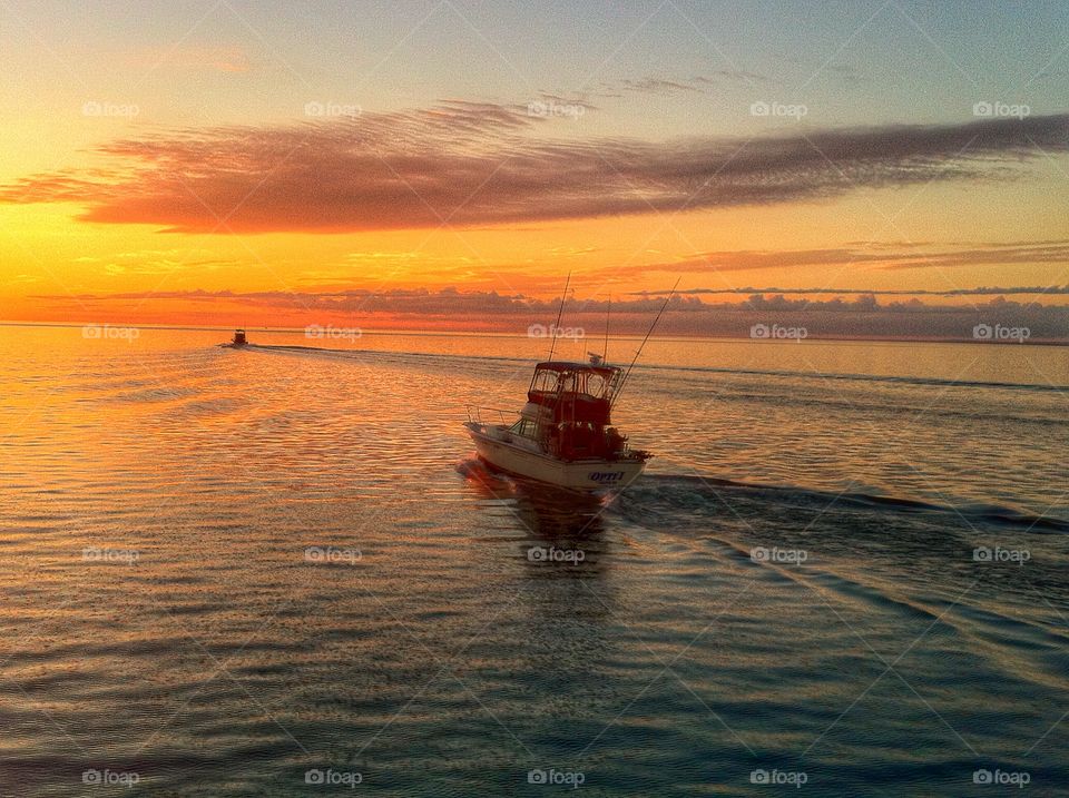 Into the magic hour. Fishing boats departing into the sunrise