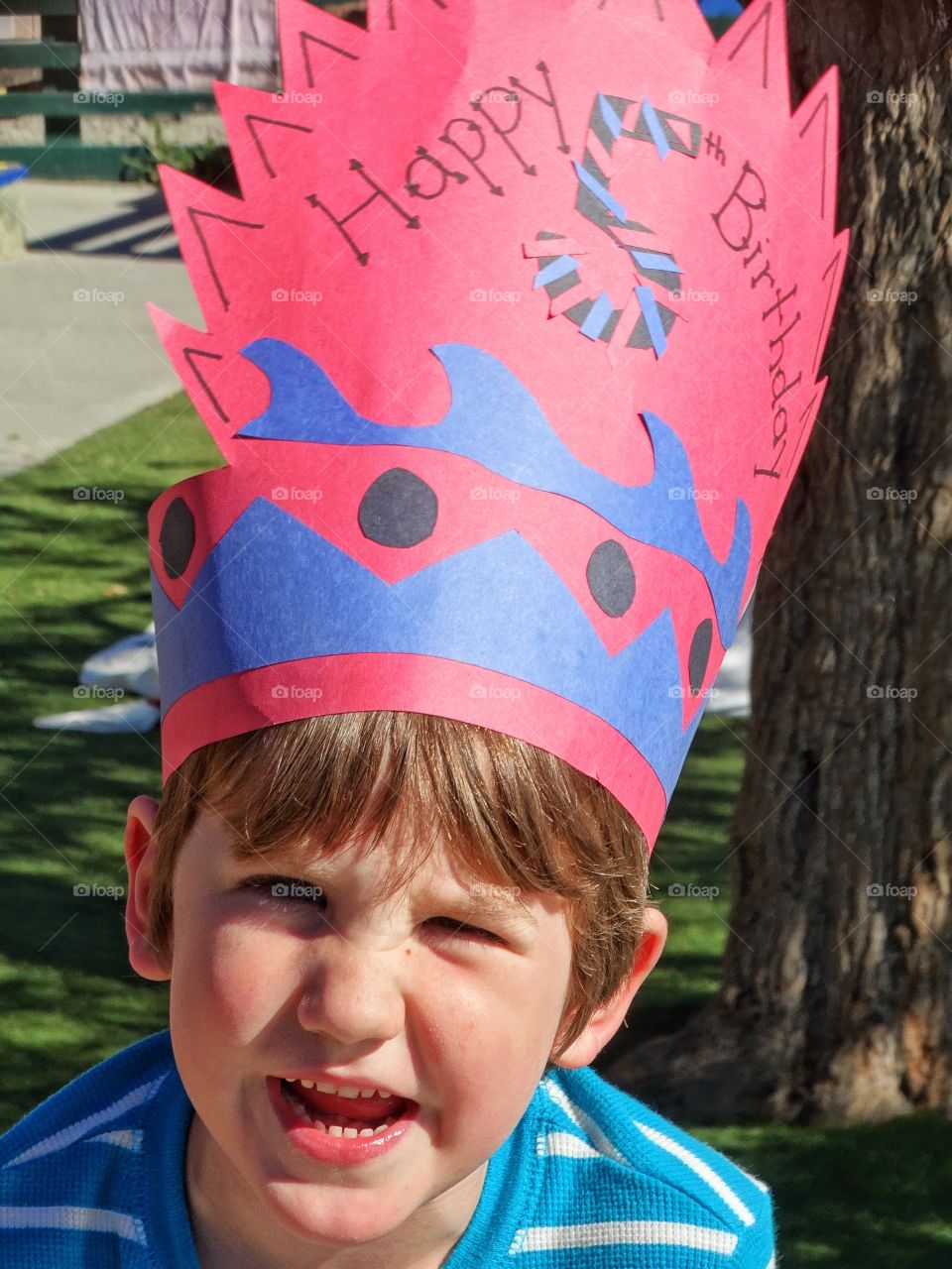 Close-up of a boy wearing handmade birthday hat
