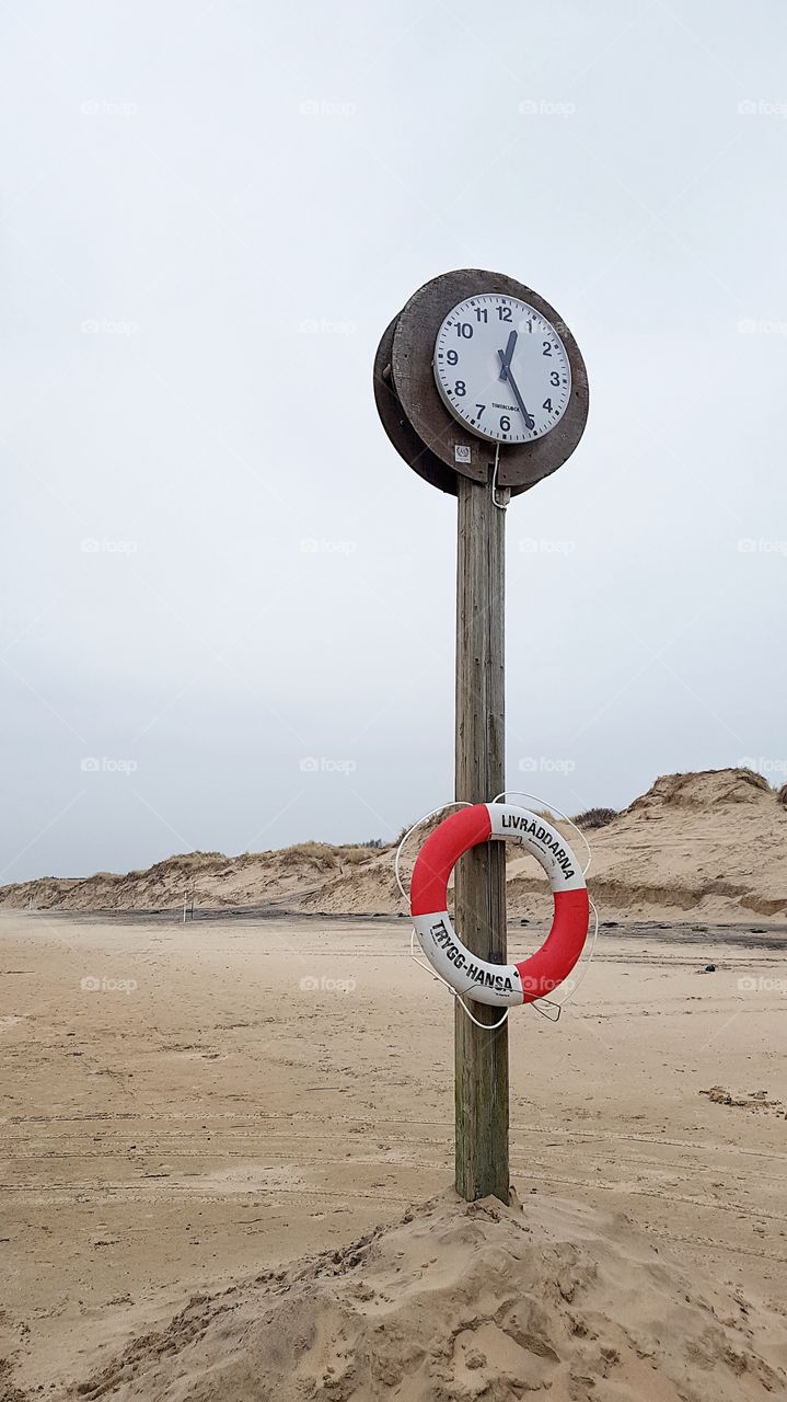  Clock on a beach.