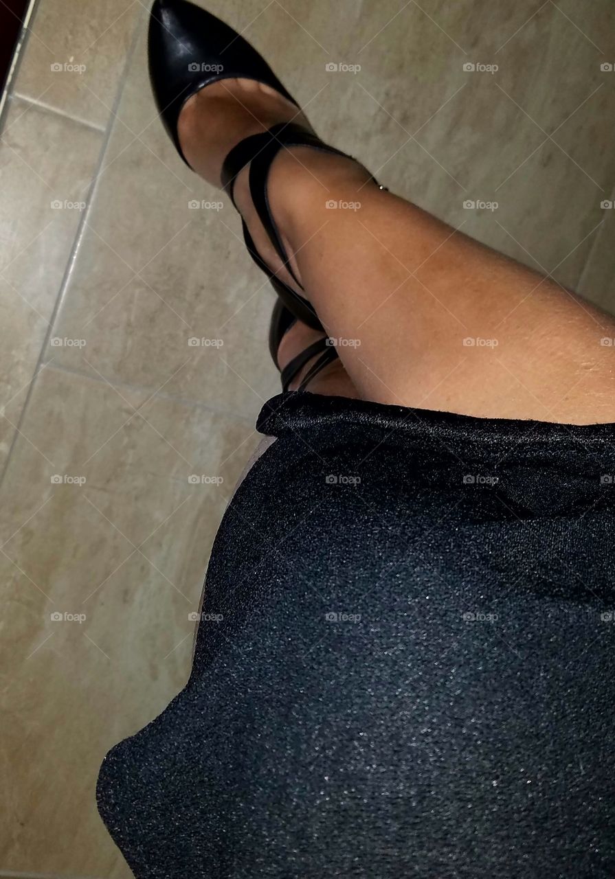 sexy strappy black 6 inch heel shoes stepping out with bare legs