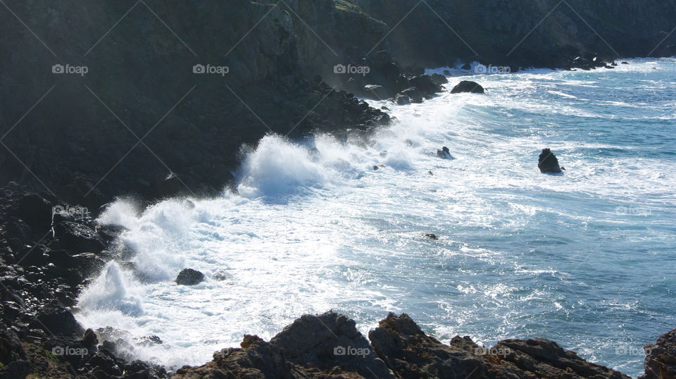 sea rough ocean spray rocks hard blue white horses