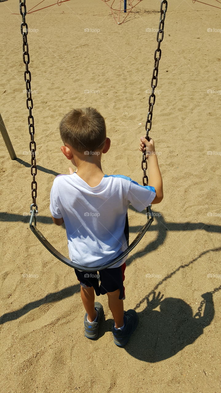 Boy On Swing