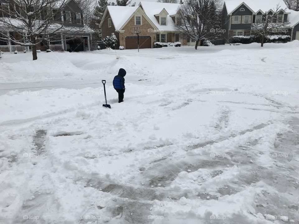 Boy playing in snow 
