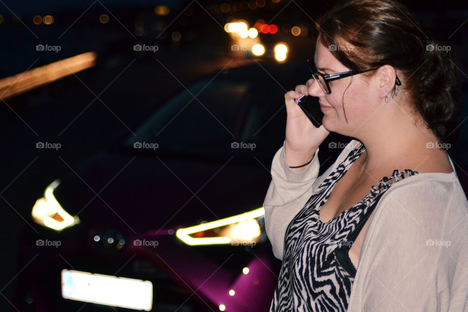 Woman on the phone and her car