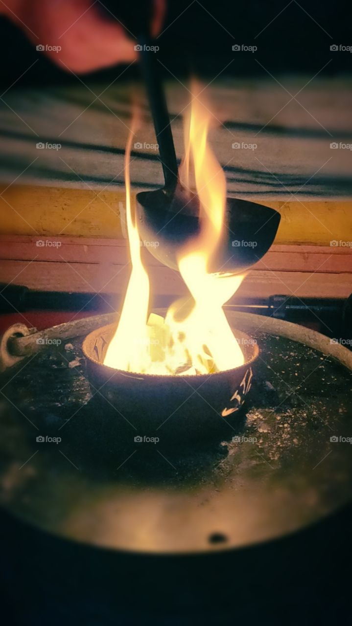 Necessity is the mother of invention /cooking in a ladle