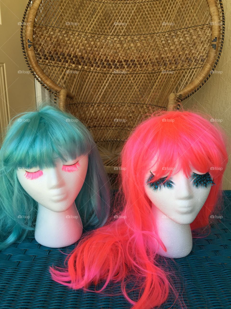 Neon wigs. Neon wigs. Bright colored wigs on mannequins. 