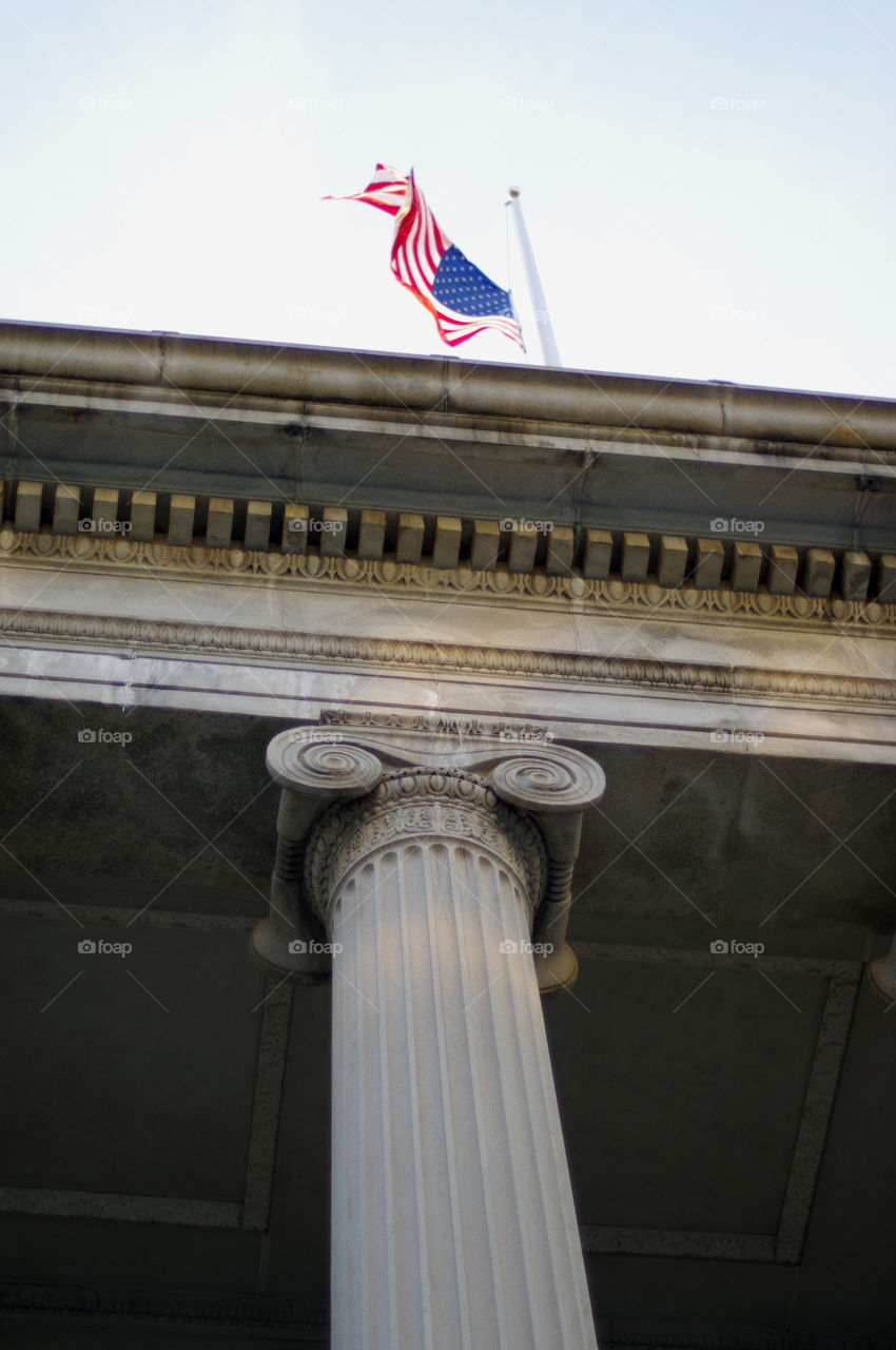 Flag flying over a federal building in Washington DC