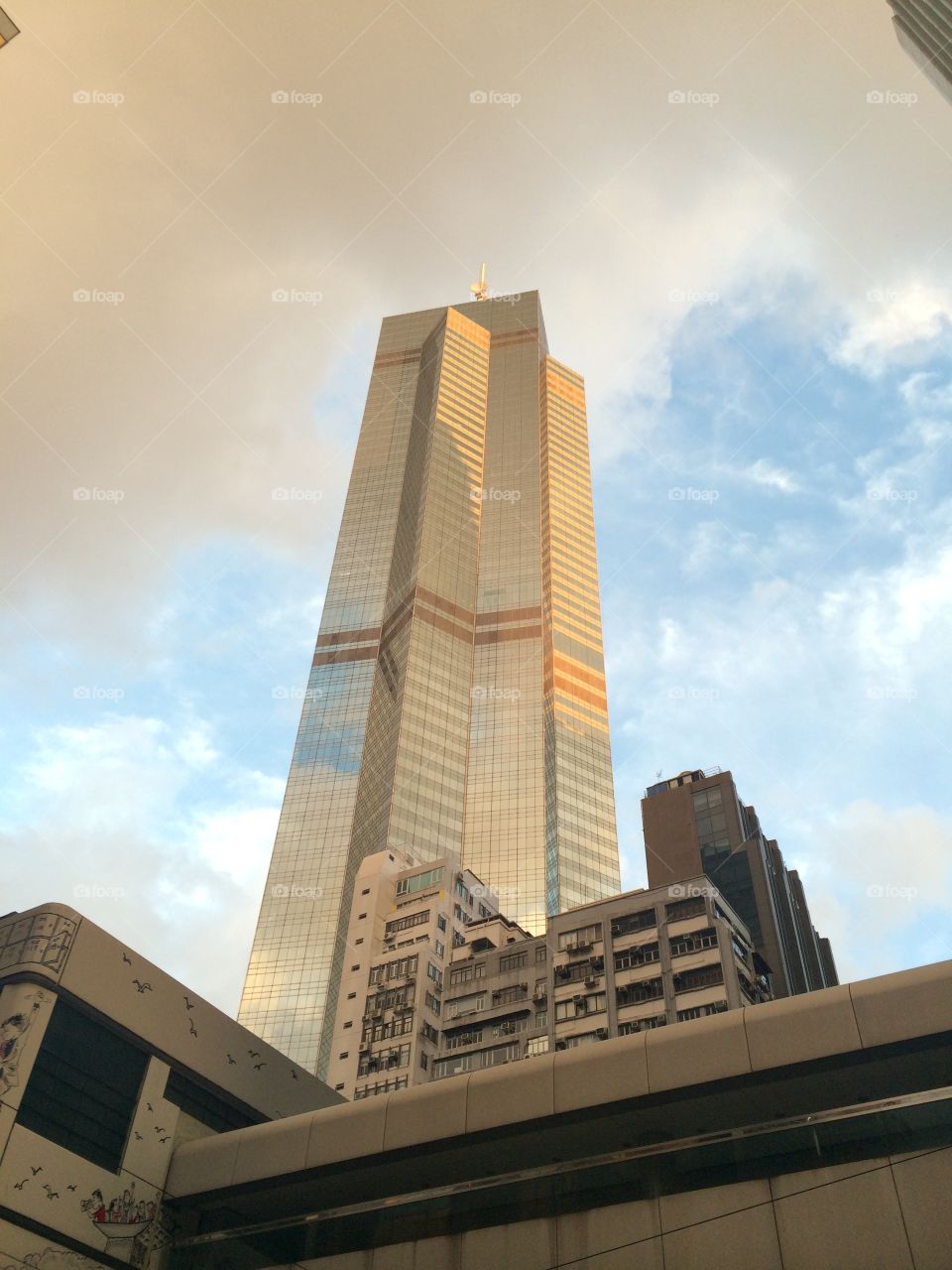 Golden city . Skyscraper in Hong Kong bathed in golden light 