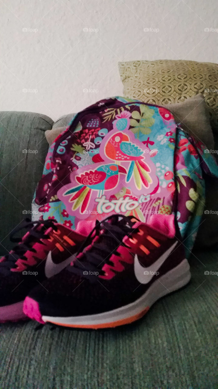 backpack with tropical design and matching sneakers.