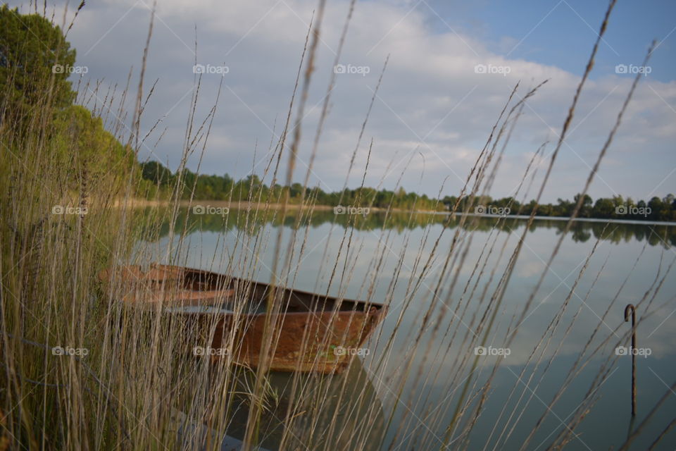 Rusted boat on the lake 