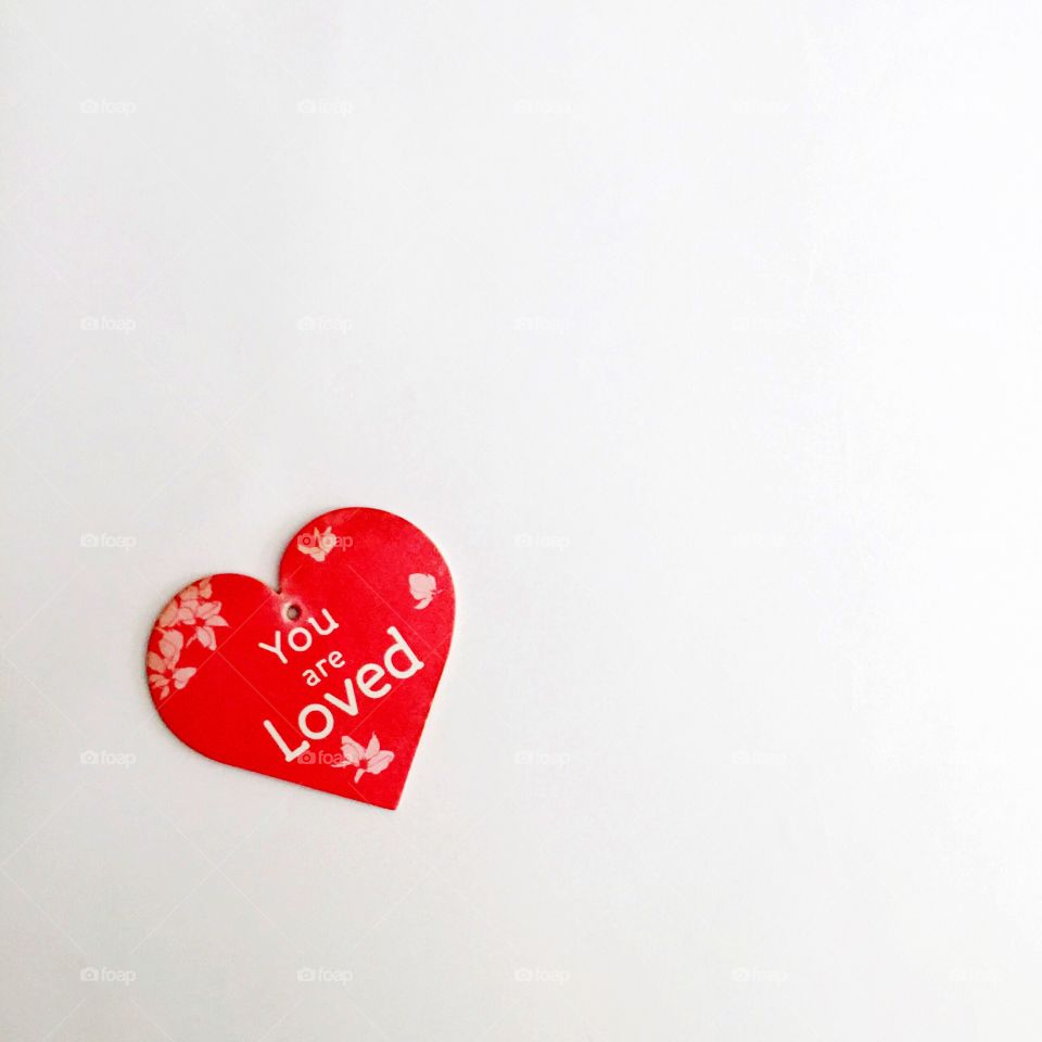 Elevated view of women message on red heart