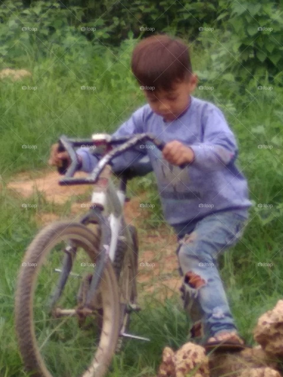 The village boy is happy to play happily