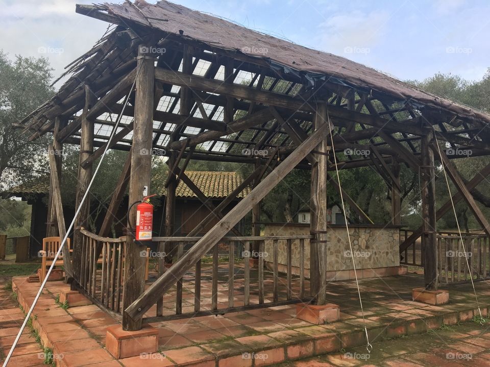 fire extinguisher and burnt house