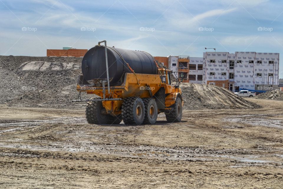 Volvo truck carrying big load. Volvo truck carrying big load at major land redevelopment project