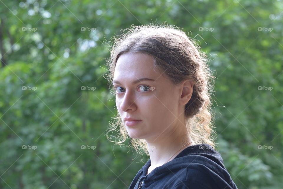 brunette girl beautiful portrait outdoor green background