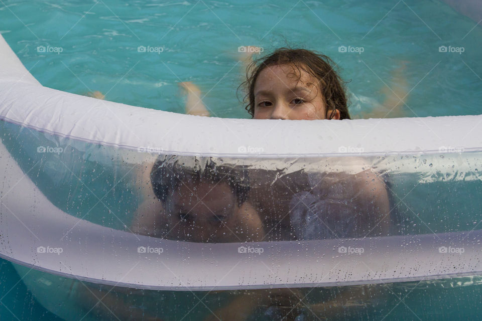 Two kids in the pool