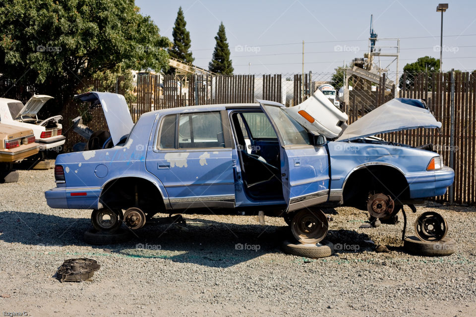 Old American car at junk yard 