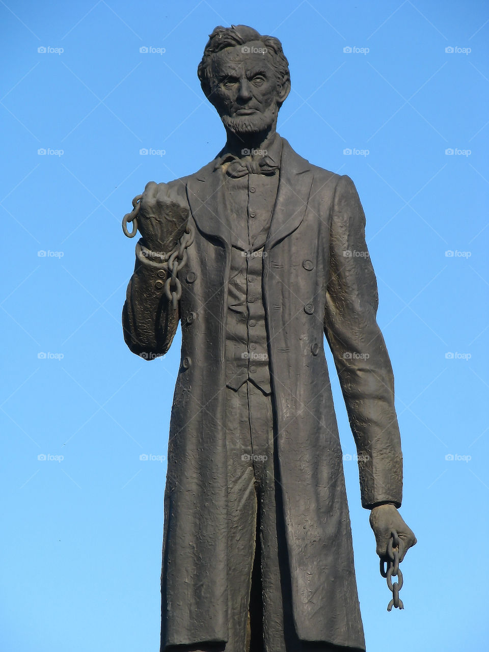 Abraham Lincoln. Lincoln Sculpture under blue sky.