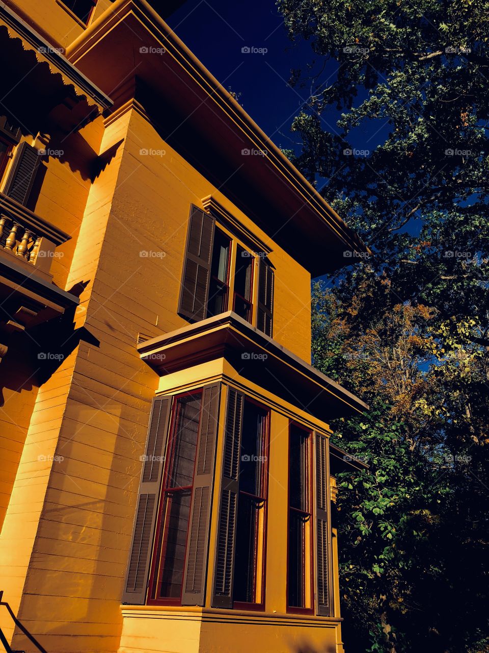 Yellow house with a bit of balcony
