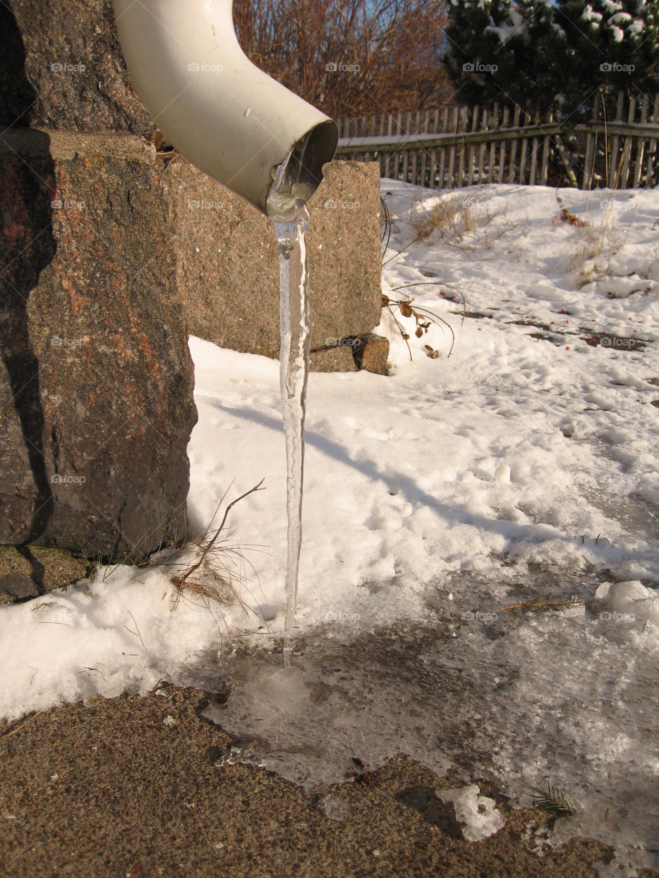 The ice melts and freezes at the same time.