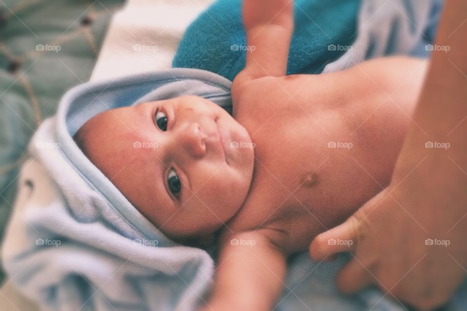 A cute baby after taking a bath
