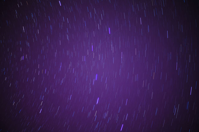 The movement of stars in a clear cloudless sky