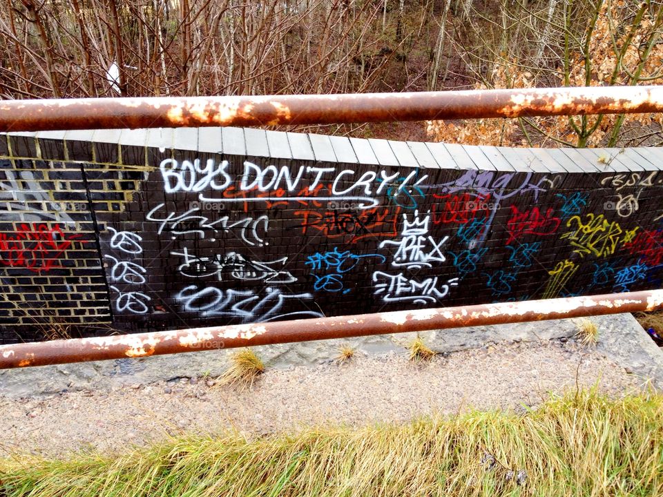 Graffiti Wall. Graffiti on low wall with railings, Sheffield, England. 