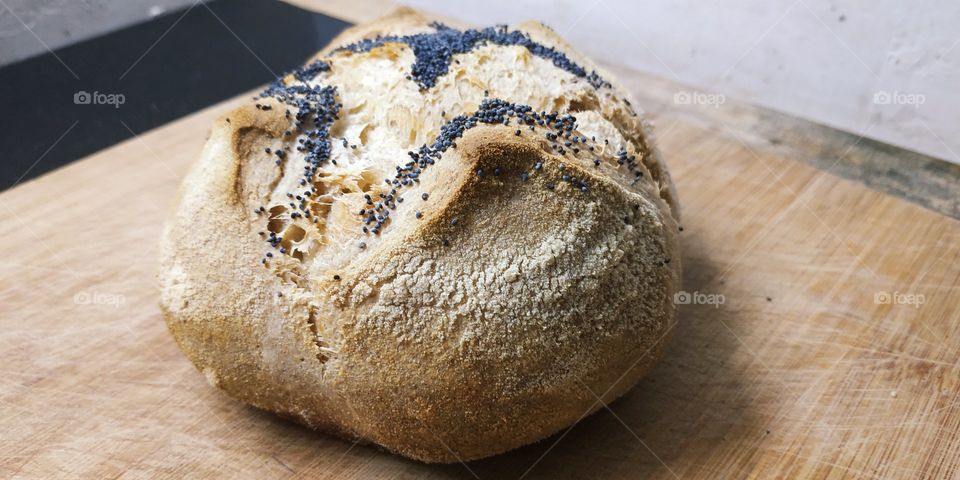 Homemade bread. Only flour, water, mother yeast, salt and fire. Contains the 4 elements: water, air in levitation, earth, wheat and fire in the oven. The artist i4elementi.it is inspired by everything that contains these elements. More is less.