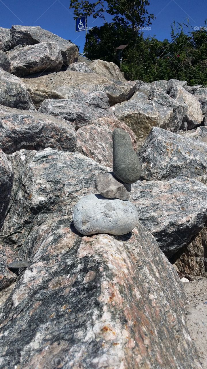 stacking rocks at the beach
