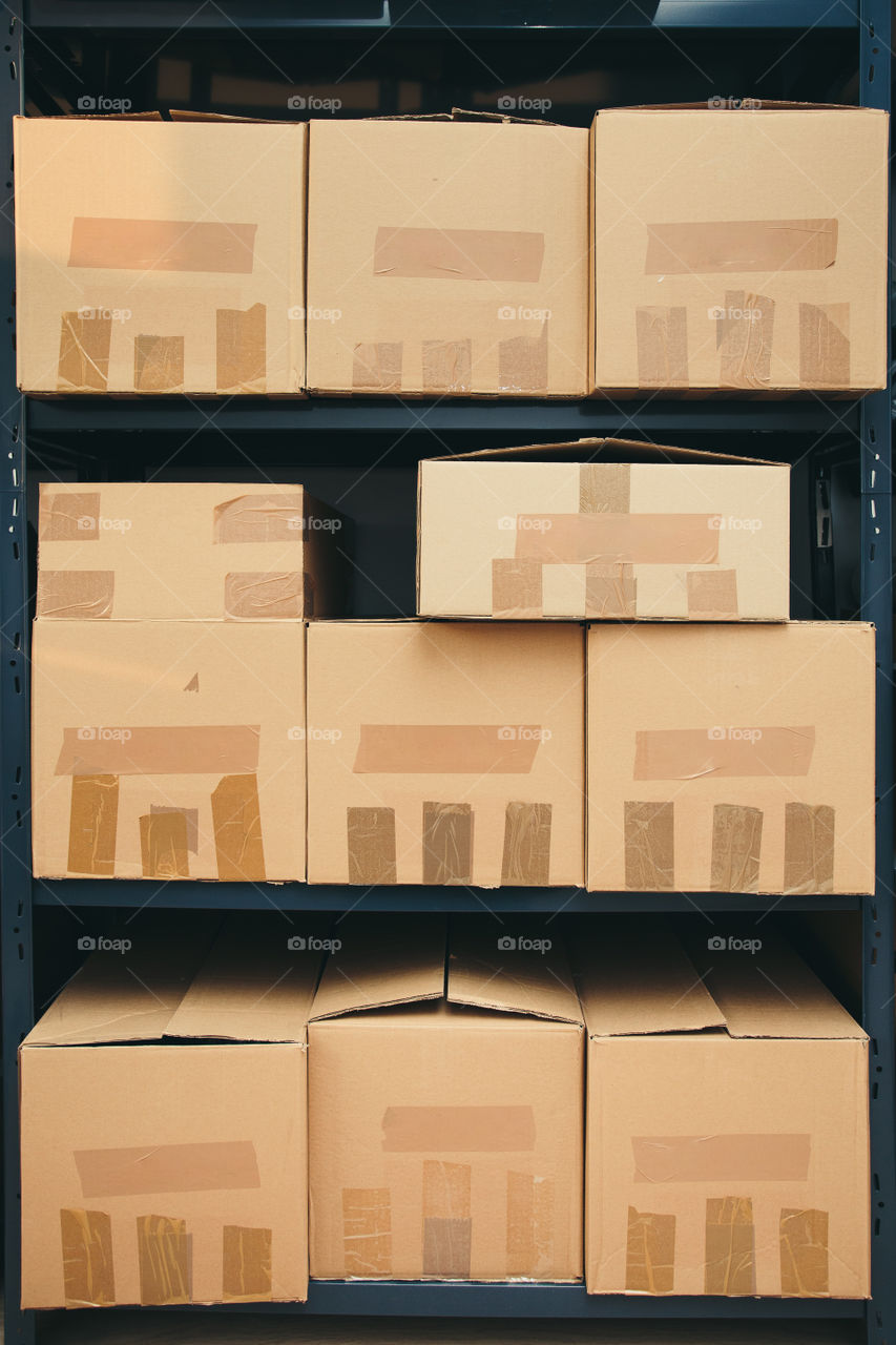 Cardboard boxes on shelves