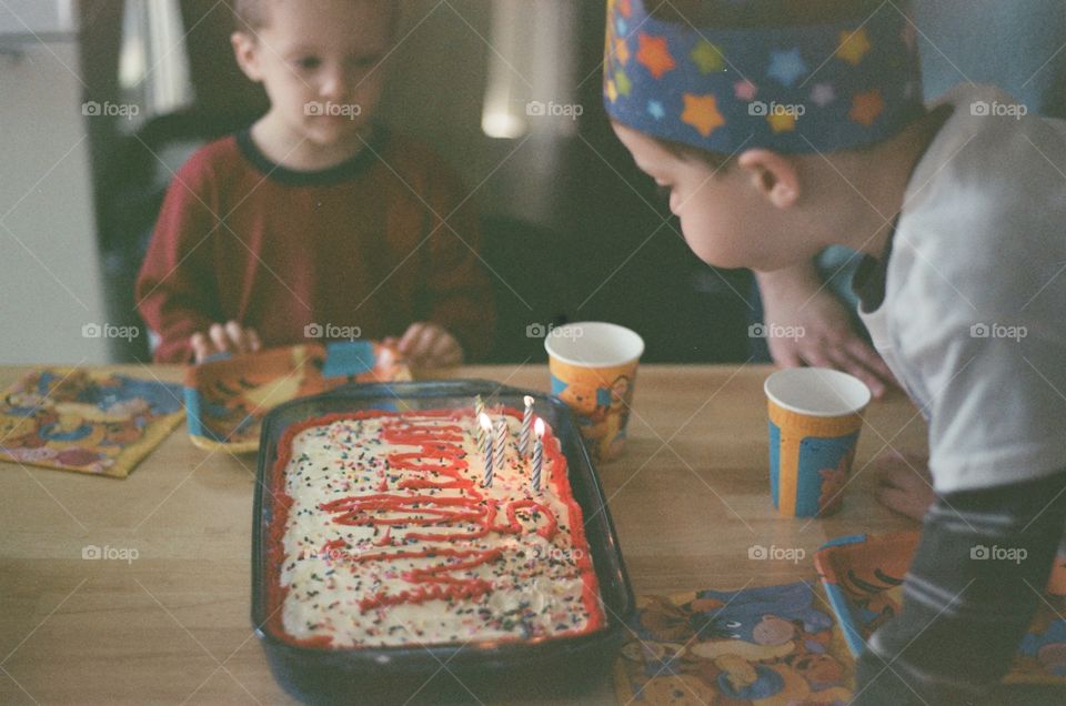5 year old me blowing out candles